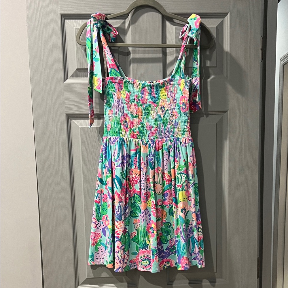 Lilly Pulitzer smocked mini dress with built in shorts.